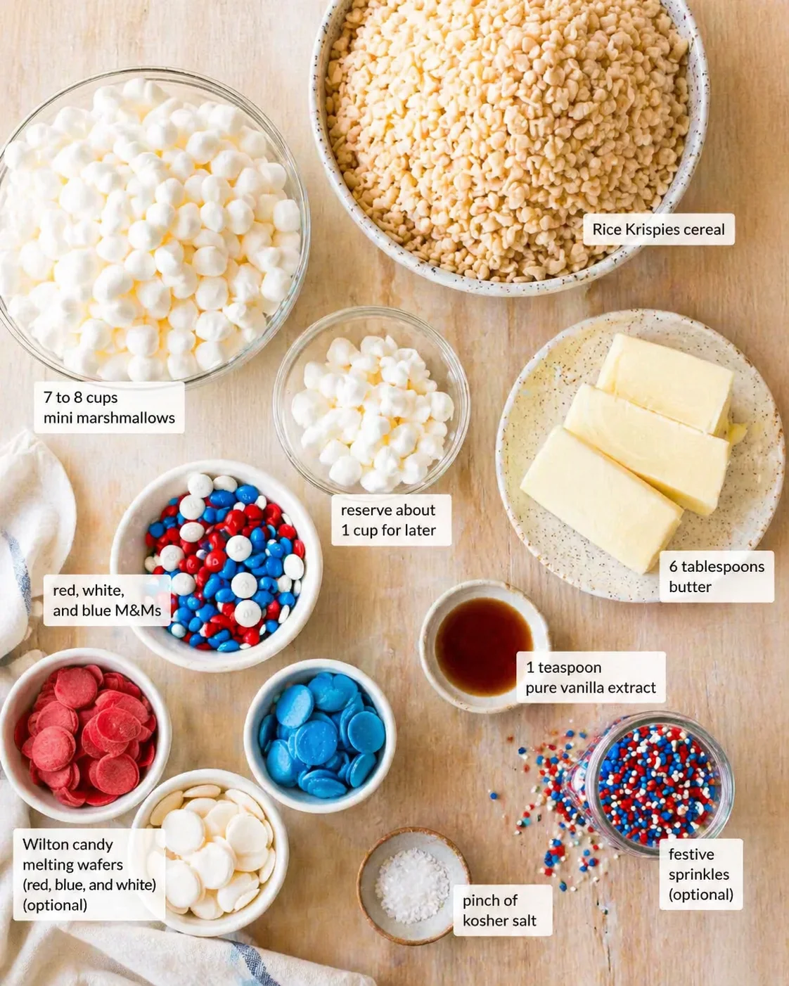 Overhead view of colorful ingredients for Rice Krispies treats, arranged in bowls and plates.