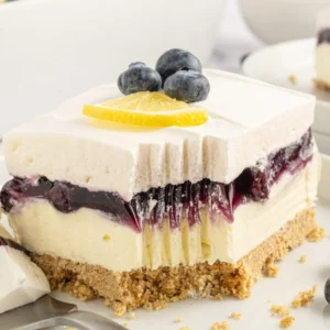 A piece of this dessert with a bite taken out of the front with a fork.