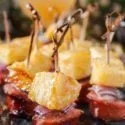 Pineapple sausage bites glazed with juicy IPA and brown sugar. Oh man! The flavor and aromas in this pineapple recipe are unbeatable. #pineapplerecipe #summerrecipe #pineapplesausage #bites #easyappetizers