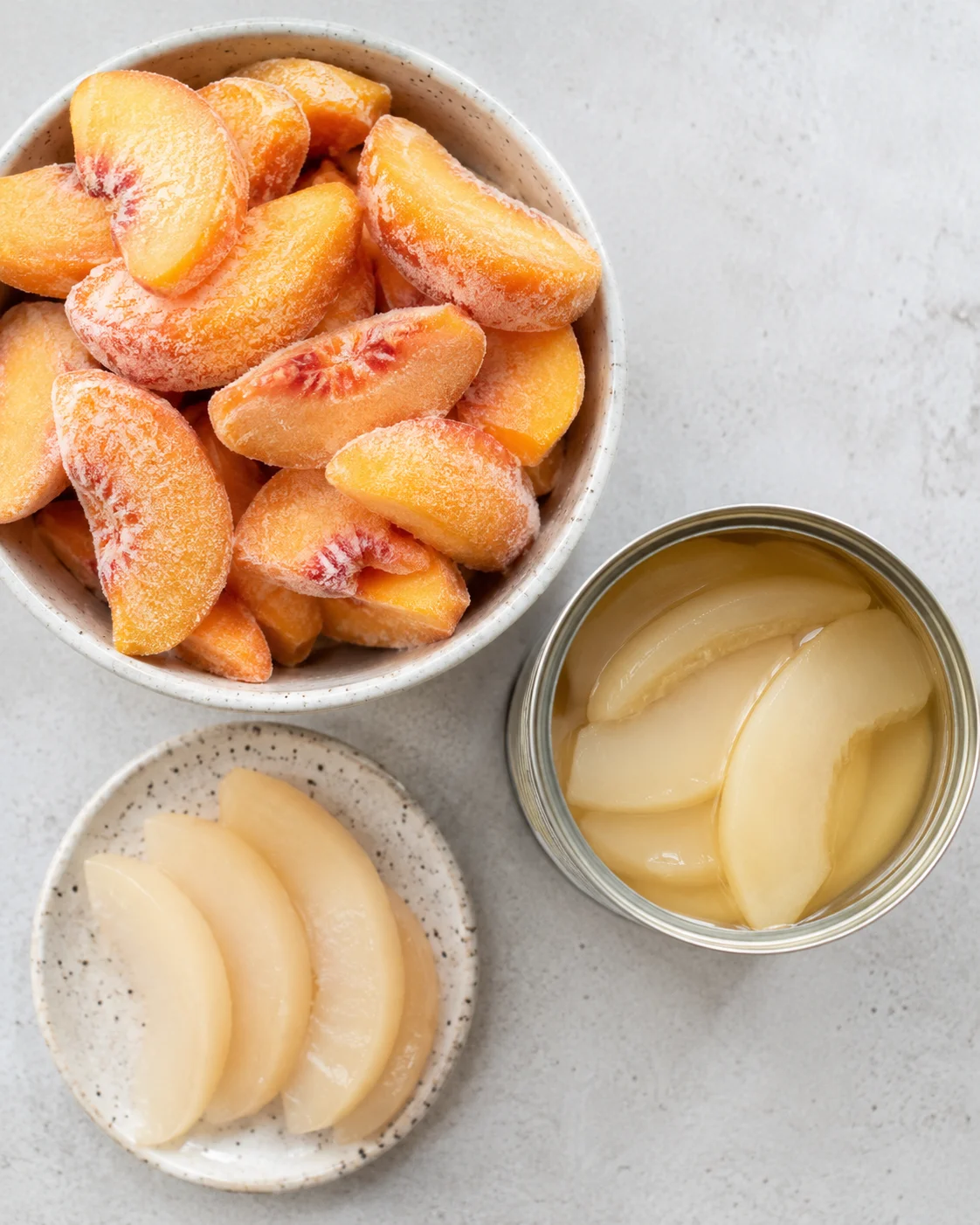 A vibrant peach smoothie with frozen peach slices, canned pears, and creamy texture.