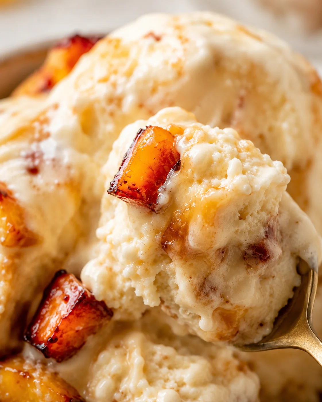 Delicious homemade roasted peach ice cream with caramelized peaches and creamy texture.