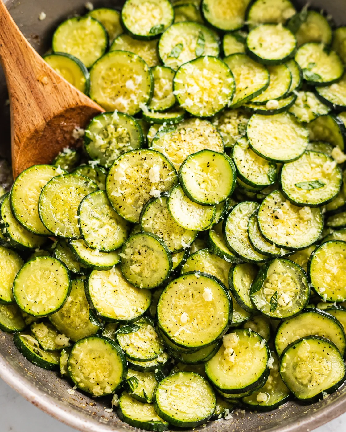 Freshly sautéed zucchini slices seasoned with garlic and Parmesan cheese.