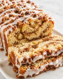 Delicious gluten-free apple fritter bread with cinnamon layers and dairy-free glaze.