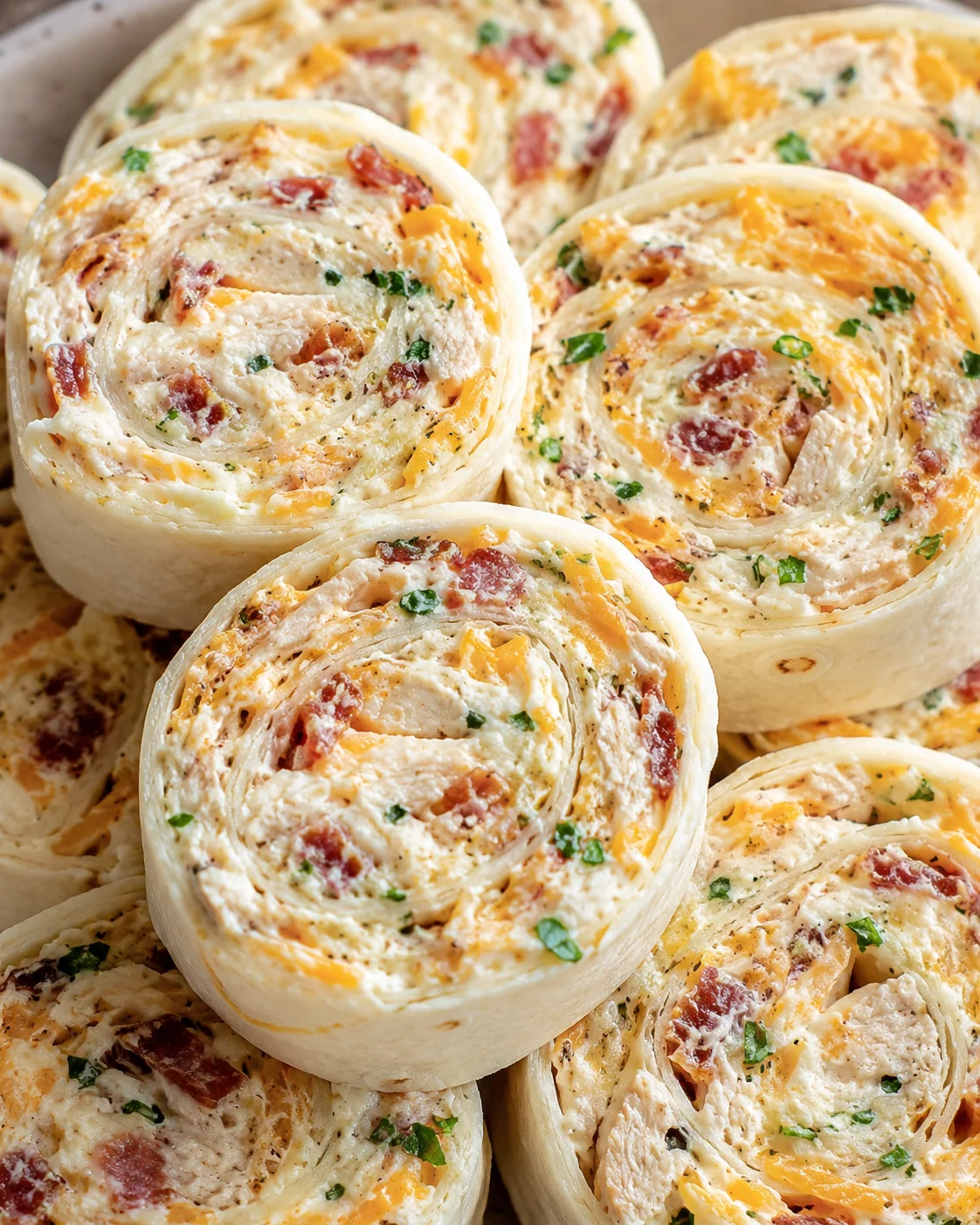 Close-up of sliced Crack Chicken Pinwheels showing swirled filling