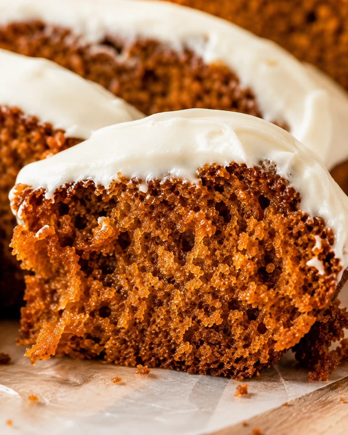 Moist pumpkin bread topped with smooth cream cheese frosting in this cozy autumn treat