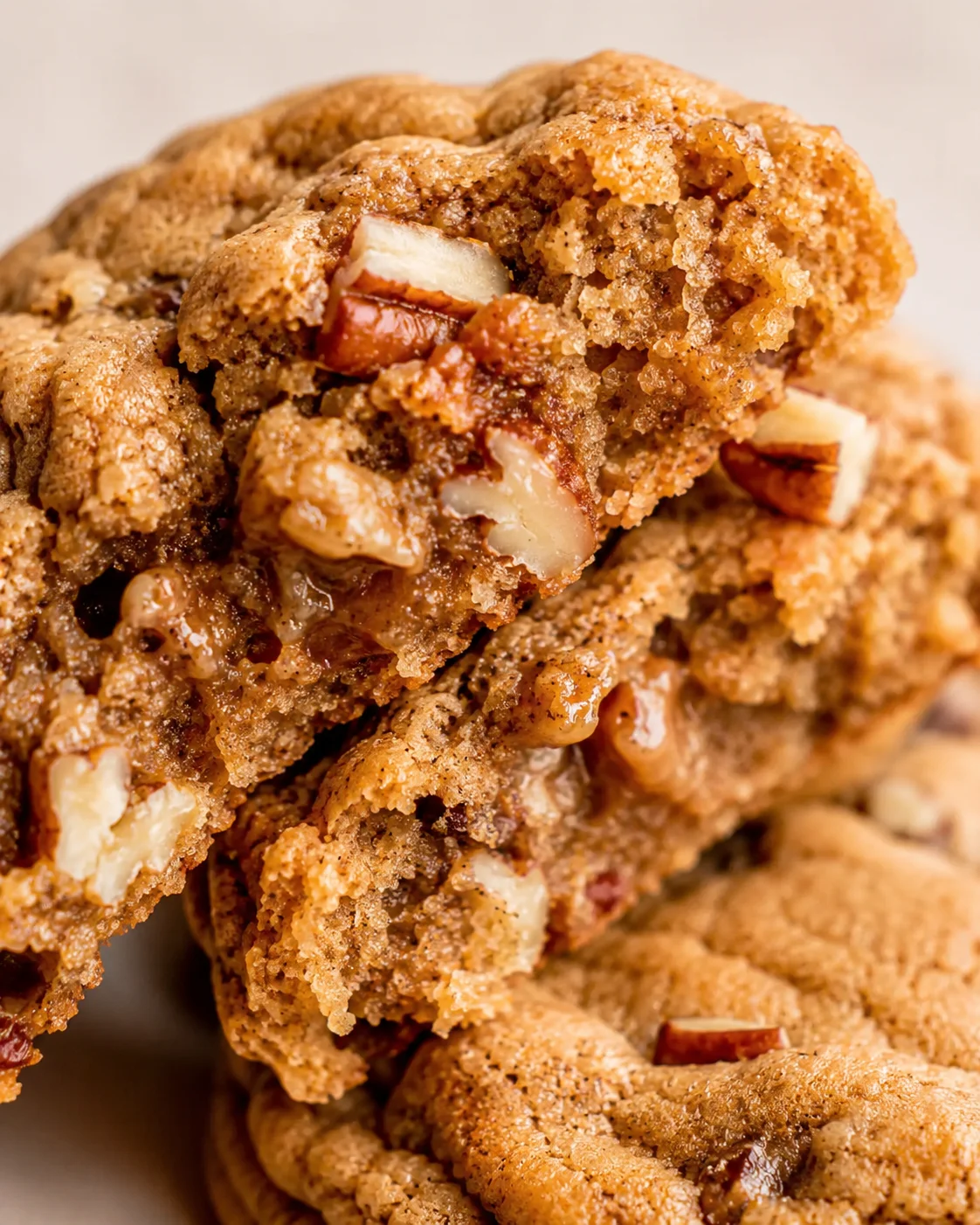Close-up of delicious chewy maple pecan cookies with nuts and warm spices.