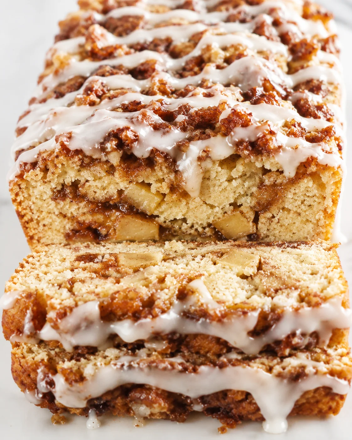 Close-up of gluten-free vegan apple fritter bread topped with icing