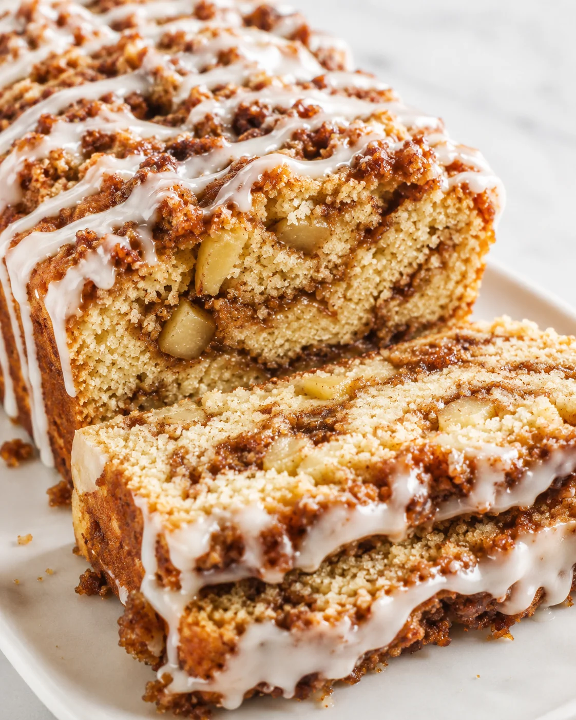 Delicious gluten-free apple fritter bread with cinnamon layers and dairy-free glaze.
