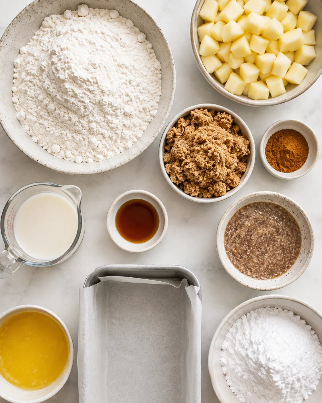Ingredients for gluten-free vegan apple fritter bread with apples and cinnamon layers.