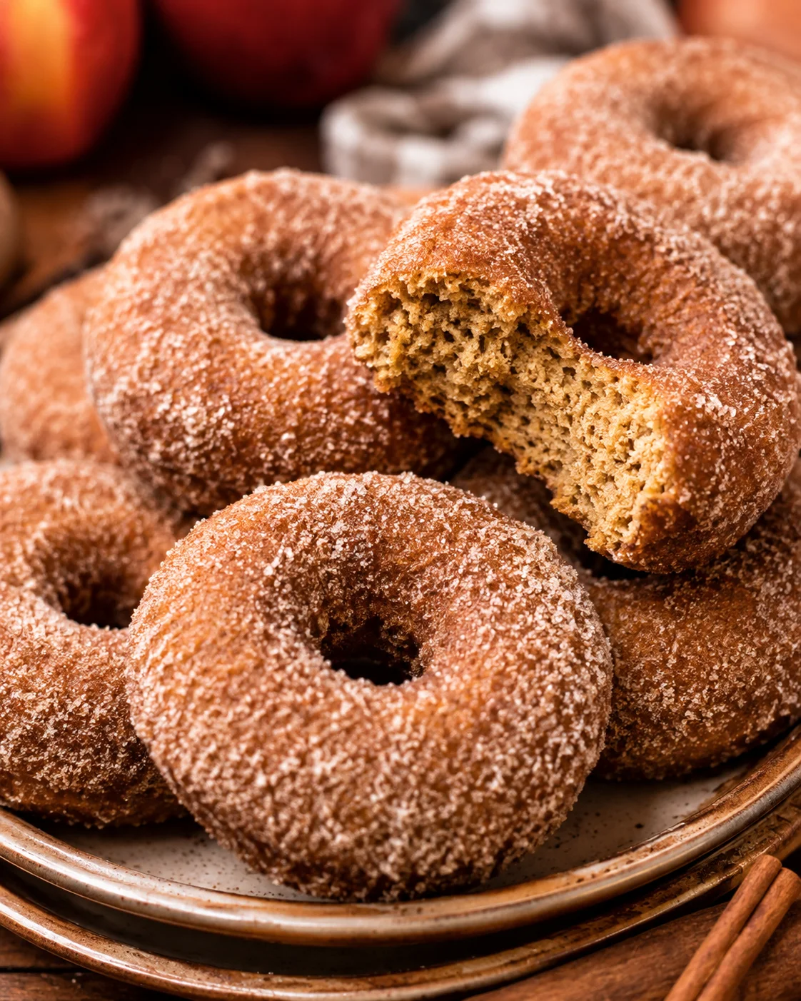 Delicious baked apple cider donuts with cinnamon sugar coating, warm and inviting.