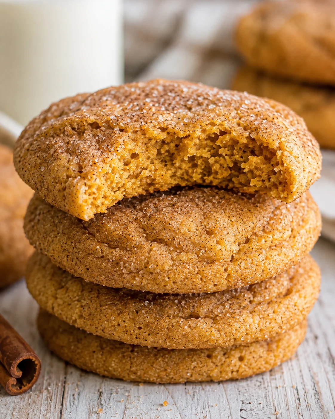 Stack of soft, chewy pumpkin snickerdoodle cookies with cinnamon sugar coating