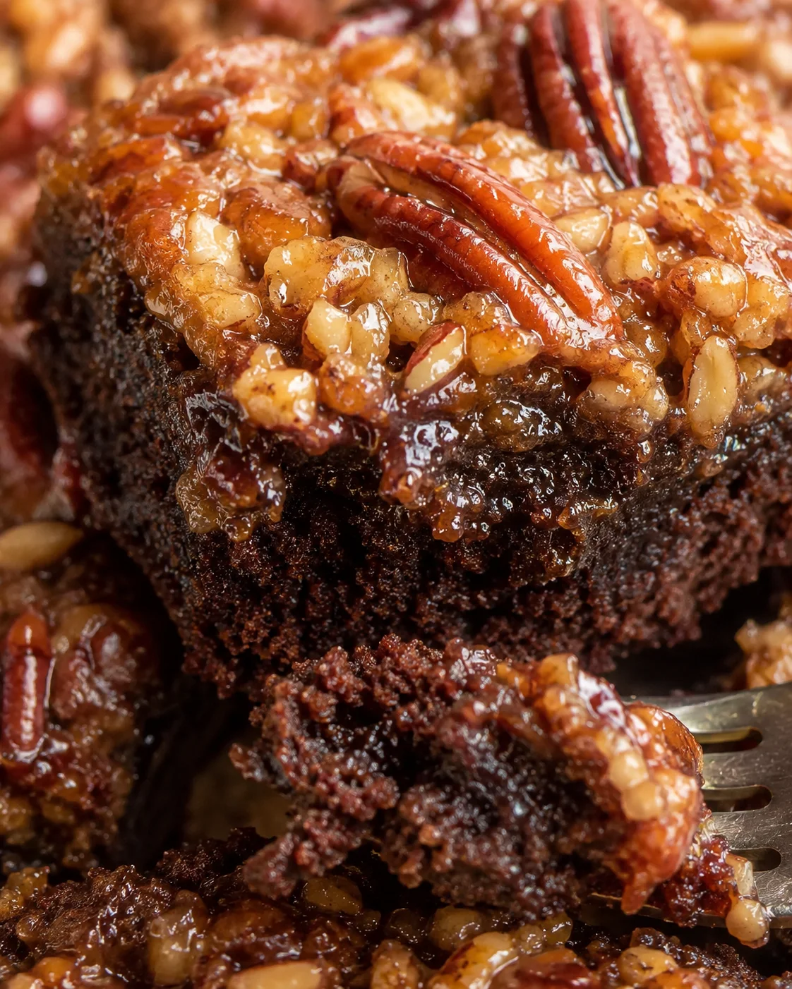 Fudgy chocolate brownie topped with a rich, sweet pecan pie layer with nuts and caramel.