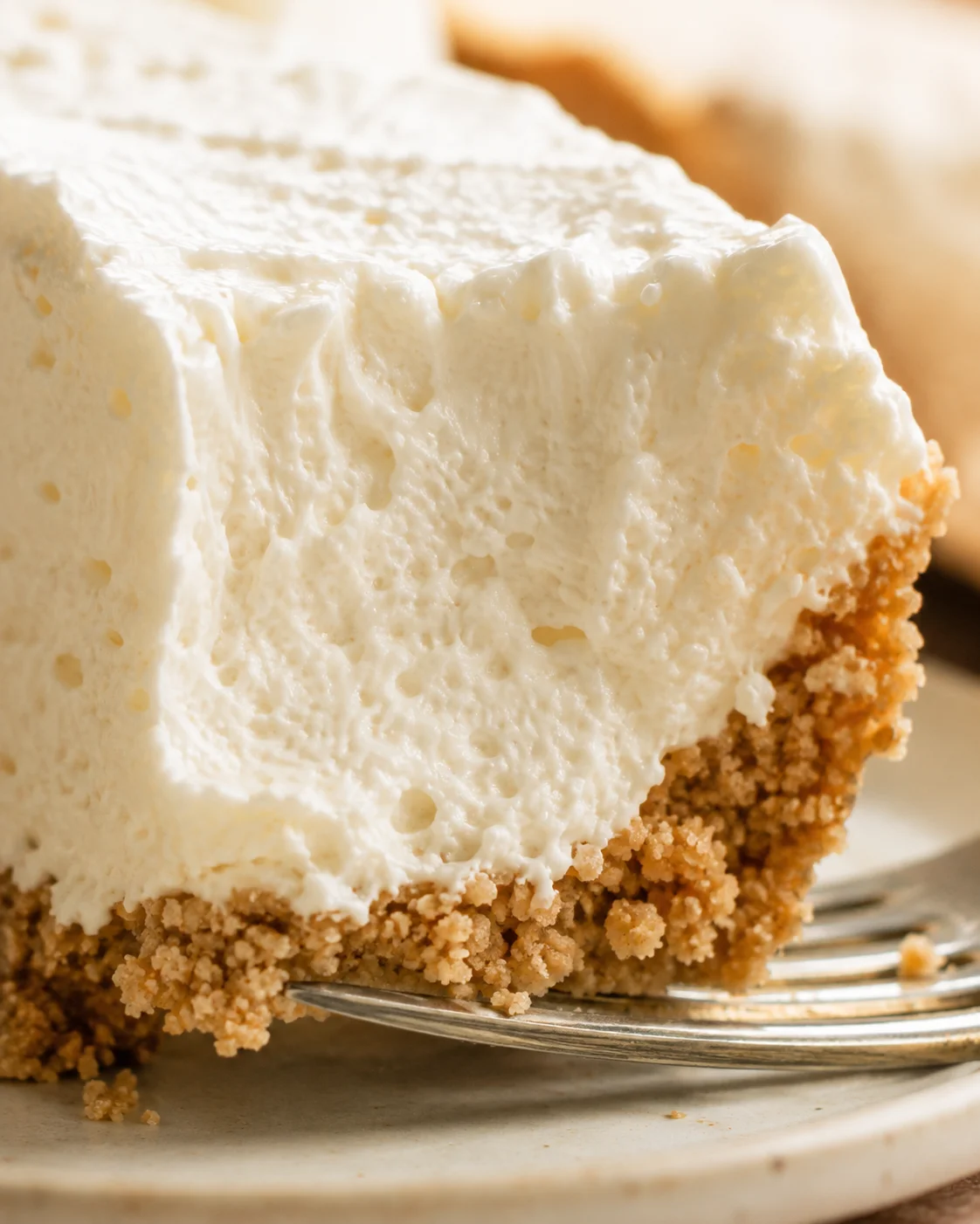 Close-up detail of the creamy interior and crumbly graham crust of a no-bake vanilla cream pie